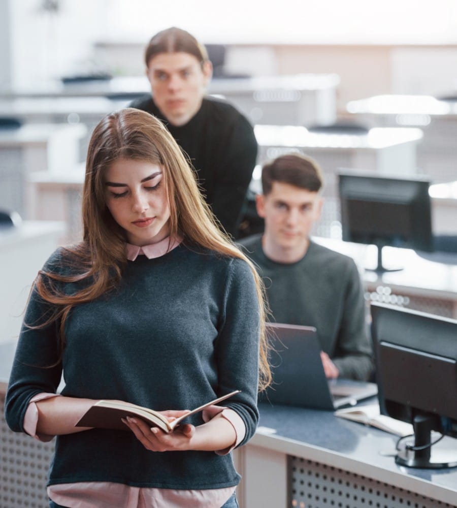 reading book group young people casual clothes working modern office